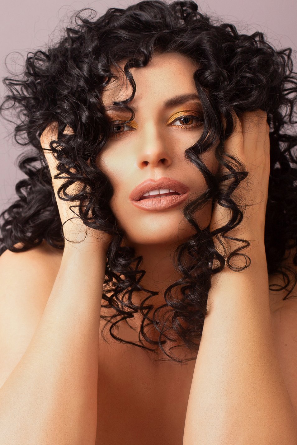 Alluring woman with curly hair